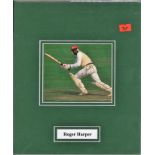 Roger Harper signed colour photo. Mounted to approx size 11x9. former West Indies cricketer turned