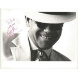 Elton John signed 10x8 b/w photo. (born Reginald Kenneth Dwight, 25 March 1947) is an English