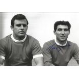 Autographed 12 x 8 photo, TONY DUNNE, a superb image depicting Dunne and his Man United team mate