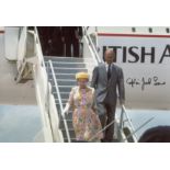 CONCORDE: 8x12 inch photo of HM the Queen alighting Concorde, signed by former Concorde Chief Pilot,