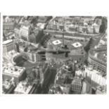 World War Two 7x8 vintage b/w photo picturing a Lancaster Bomber in flight over London. Good