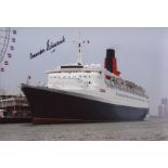 CUNARD QE2: 8x12 inch photo of the QE2 signed by her last ever captain Commodore R Warwick. Good