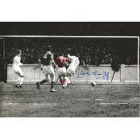 Autographed 12 X 8 Photo, John Connelly, A Superb Image Depicting Connelly Scoring For Manchester