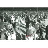 Autographed 12 X 8 Photo, Lou Macari, A Superb Image Depicting Macari And Martin Buchan Holding