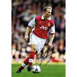 Football Dennis Bergkamp 16x12 signed colour photo pictured in action for Arsenal. Good Condition.