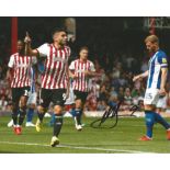 Neal Maupay Signed Brentford 8x10 Photo. Good Condition. All signed pieces come with a Certificate