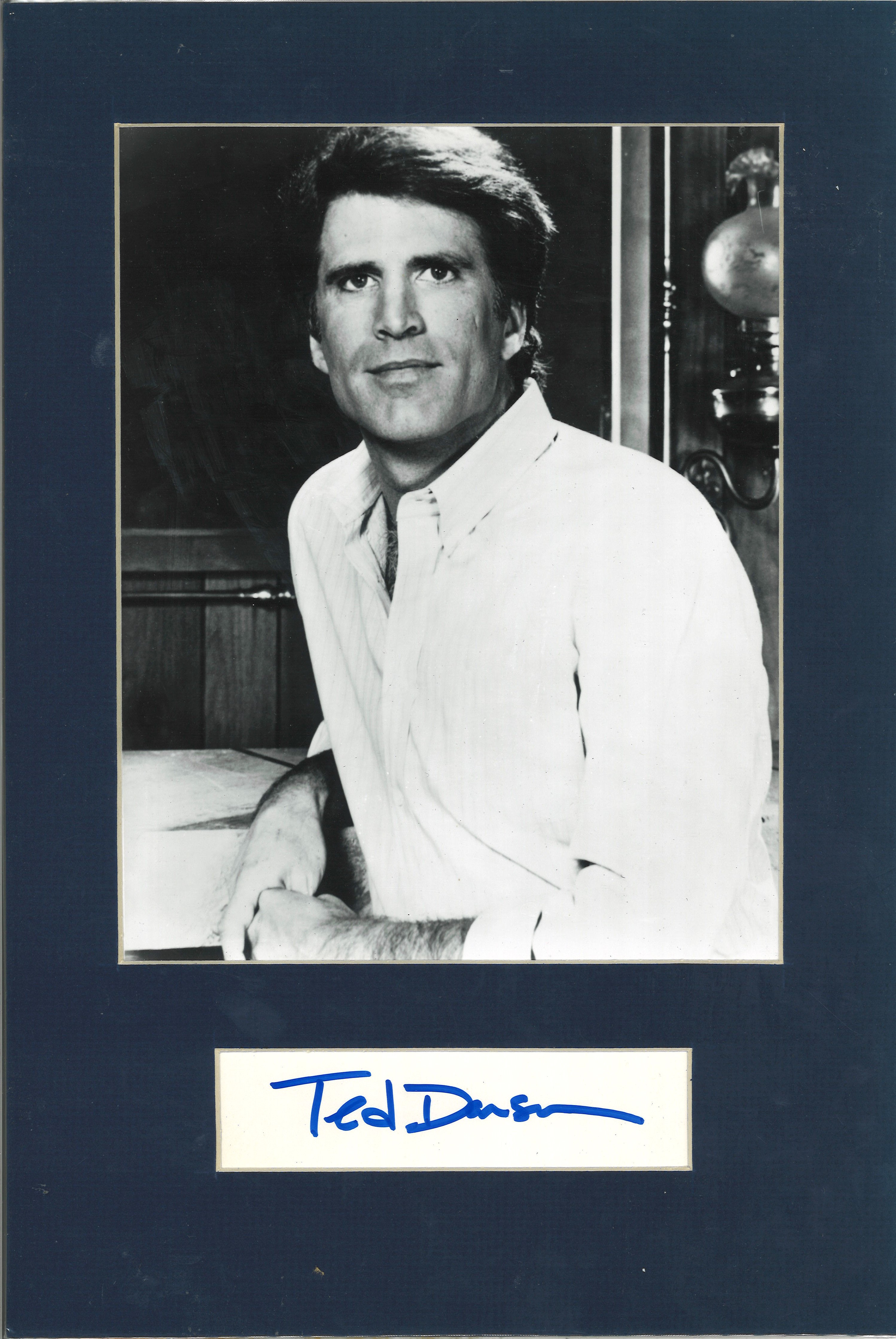 Ted Danson signed card mounted with 10 x 8 unsigned b/w photo to approx 16 x 12. Good Condition. All