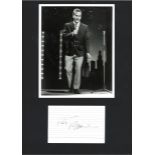 Pat Boone signed white lined card fixed with unsigned 10x8 b/w photo to black A3 card. Good