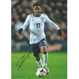 Raheem Sterling Signed England 8x12 Photo. Good Condition. All signed pieces come with a Certificate