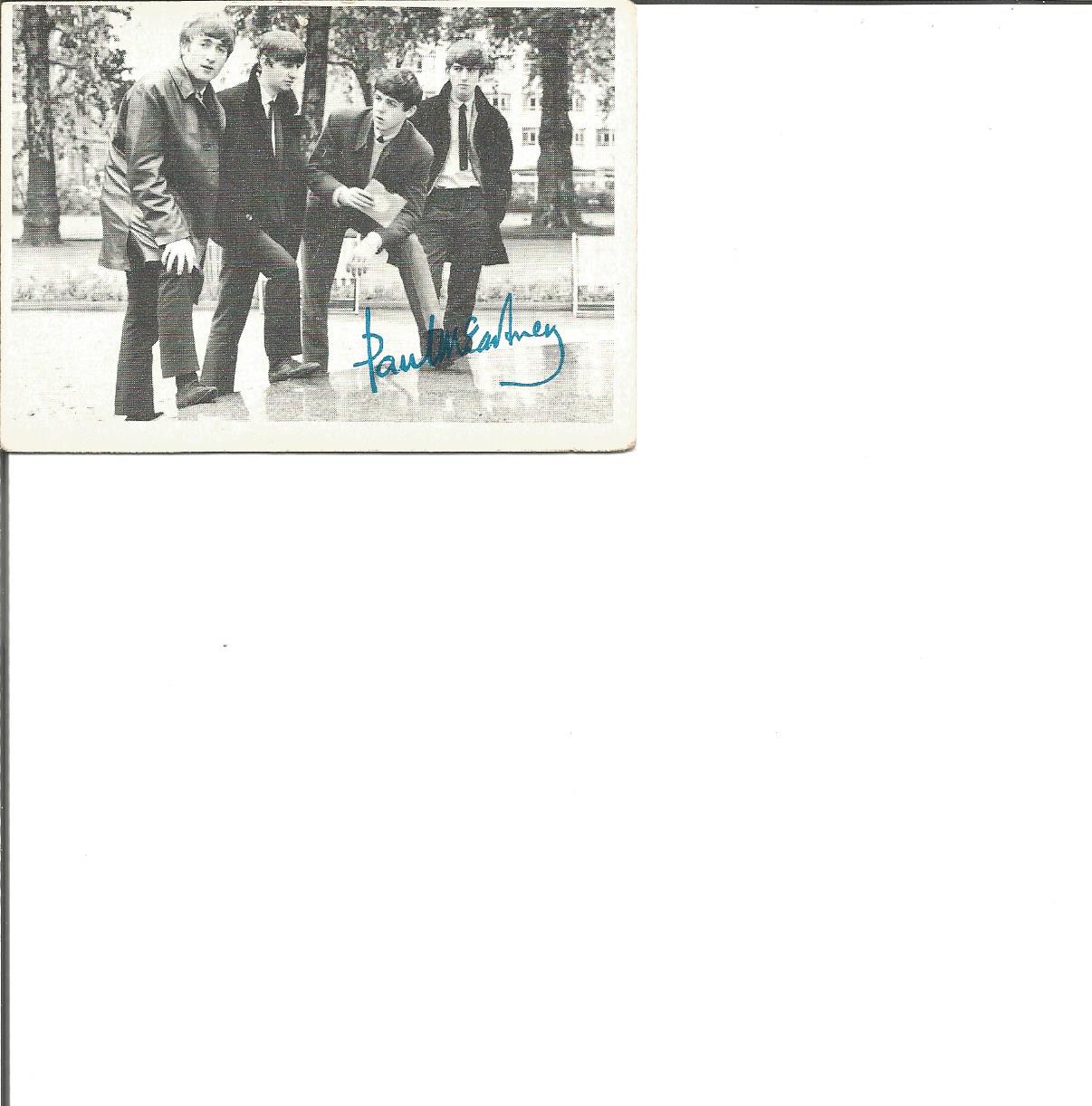 Paul McCartney small trading card with PRINTED autograph. Numbered 21 in a series of 60 photos. Good