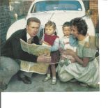 Harry Gregg signed 5x5 colour magazine photo with his family. Few tape marks. Good Condition. All