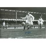 Football Autographed 12 x 8 photo, depicting John Giles in full length action during his final