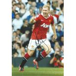 Football Autographed 12 x 8 photo, depicting Manchester United's Paul Scholes celebrating after