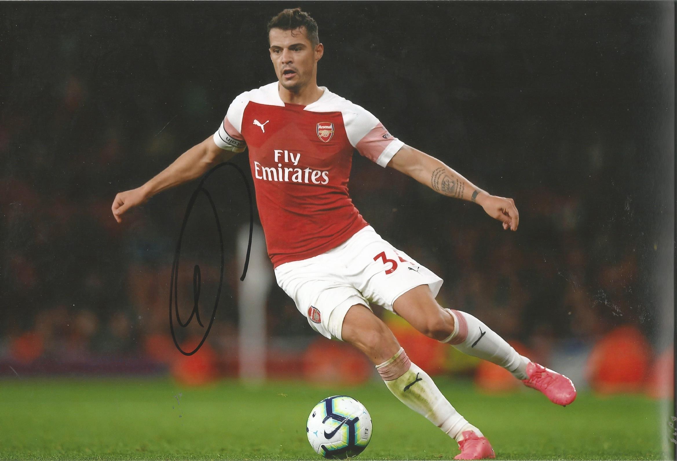 Granit Xhaka Signed Arsenal 8x10 Photo. Good Condition. All signed pieces come with a Certificate of