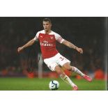Granit Xhaka Signed Arsenal 8x10 Photo. Good Condition. All signed pieces come with a Certificate of