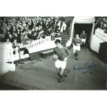 Football Autographed 12 x 8 photo, depicting Manchester United's George Best closely followed by