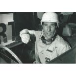 Stirling Moss signed 12x8 b/w photo. Good Condition. All signed pieces come with a Certificate of