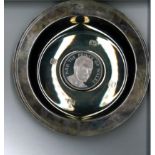 Pobjoy Mint Silver Prince Charles plate in nice blue presentation box. About 6 inches wide and