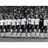 Willi Schulz An 8" X 6" Photo Depicting The West German Team Standing Shoulder To Shoulder For Their