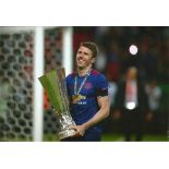 Football Michael Carrick 8x12 signed colour photo pictured holding the Europa League Trophy after