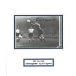 Football Gill Merrick signed 12x10 mounted b/w photo pictured in action for England. Gilbert