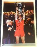 Football Phil Thompson 16x12 signed colour photo pictured lifting the European Cup for Liverpool.