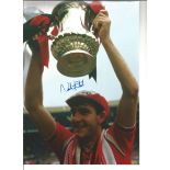 Autographed Norman Whiteside photo, a superb image depicting Manchester United's match-winner