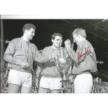 Autographed Denis Law photo, a superb image depicting Manchester United's Law and teammates Pat