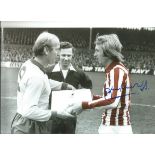 Autographed Jimmy Greenhoff photo, a superb image depicting the Stoke City captain presenting his