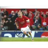 Autographed Paul Scholes photo, a superb image depicting Scholes running away in celebration after