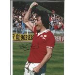 Autographed Stuart Pearson photo, a superb image depicting the Manchester United striker punching