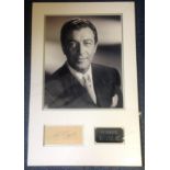 Robert Taylor signature piece mounted below b/w photo. Approx overall size 23x14. Good Condition.