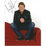 Michael Ball signed great 10x8 colour photo sitting on couch. Good Condition. All signed pieces come