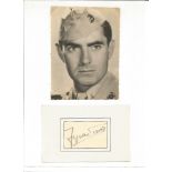 Tyrone Power small signature piece stuck to paper below sepia photo. Good Condition. All signed