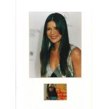 Patricia Velasquez signature piece mounted below colour photo. Approx overall size 16x12. Good