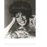Shirley Bassey signed 7x5 b/w photo. Good Condition. All signed pieces come with a Certificate of