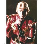 Sam J. Jones Flash Gordon hand signed 10x8 photo. This beautiful hand signed photo depicts Sam J.