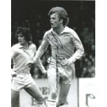 Gordon McQueen signed 10x8 b/w photo pictured in action for Leeds United. Good Condition. All signed