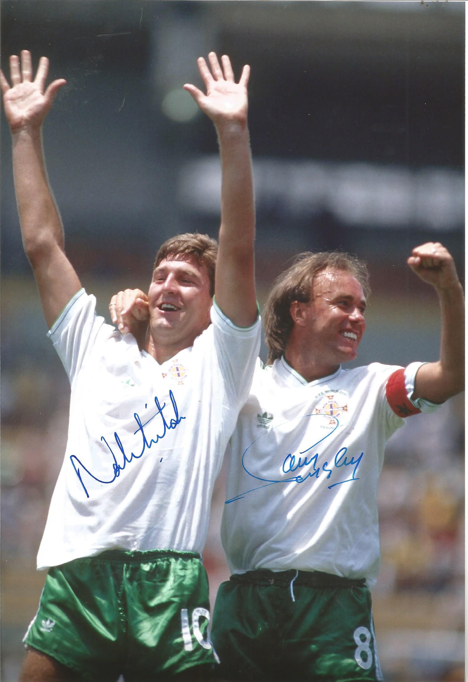 Autographed N IRELAND 1986 photo, a superb image depicting NORMAN WHITESIDE celebrating with team