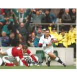 Rory Underwood signed 8x10 colour photo pictured in action for England. Good Condition. All signed