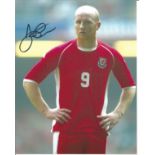 John Hartson signed 10x8 colour photo pictured in action for Wales. Good Condition. All signed