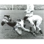 J.P.R Williams signed 8x10 b/w photo pictured in action for Wales. Good Condition. All signed pieces