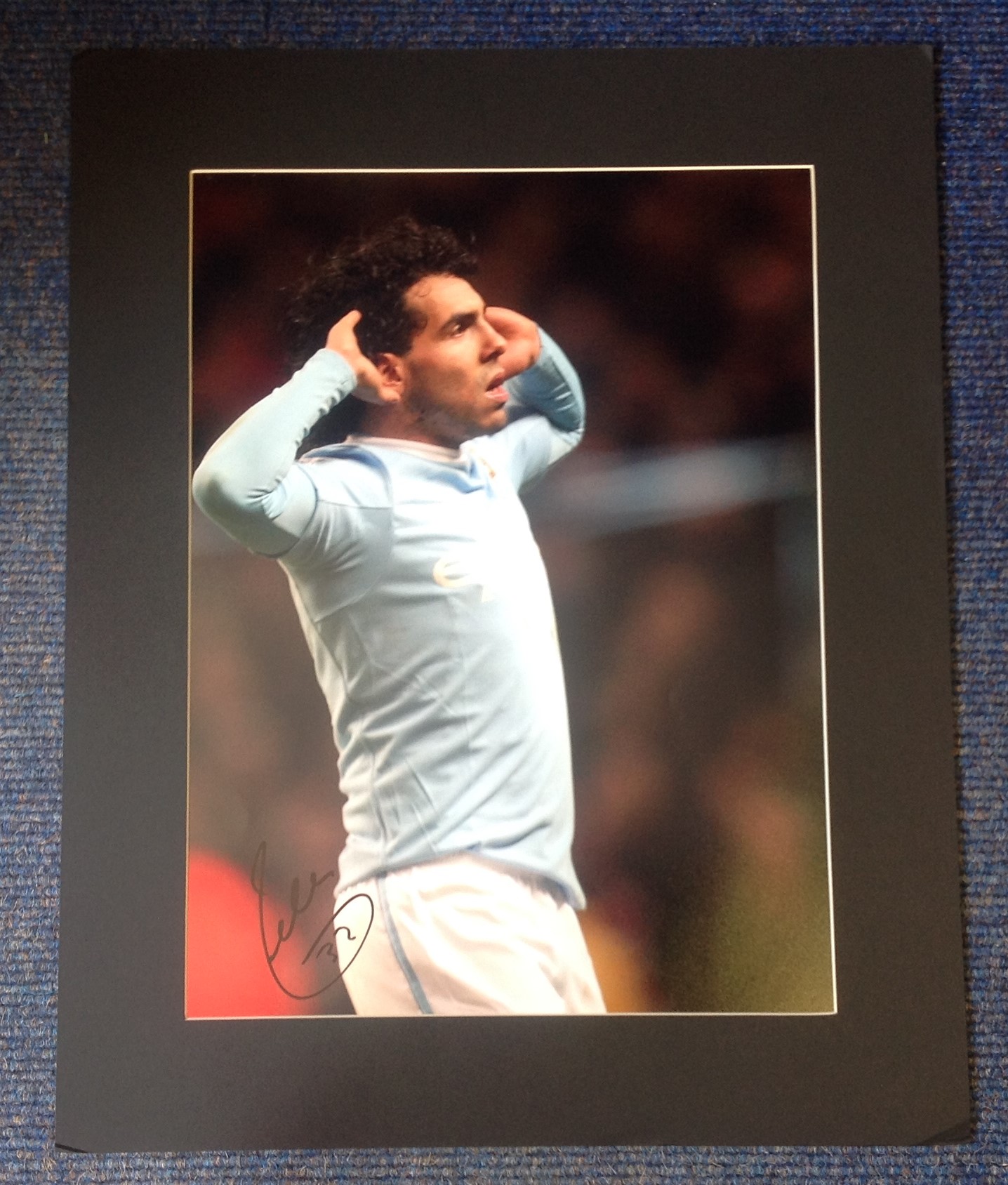 Carlos Tevez signed colour Man City photo. Mounted to approx size 16x20. Good Condition. All