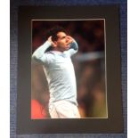 Carlos Tevez signed colour Man City photo. Mounted to approx size 16x20. Good Condition. All