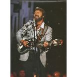 Glen Campbell signed 12x8 colour magazine photo. Dedicated. Good Condition. All signed pieces come