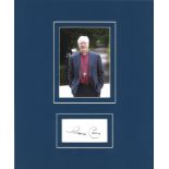 George Carey signature piece mounted below colour photo. retired Anglican bishop who was the