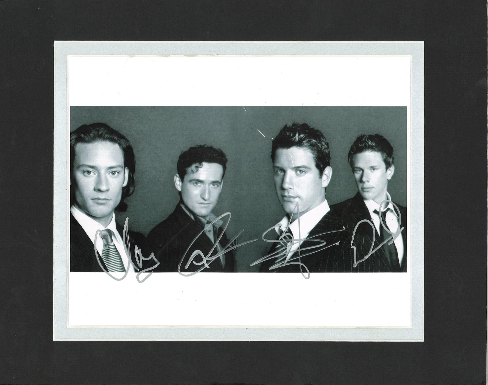 Il Divo signed b/w photo. Mounted to approx 14x11. Good Condition. All signed pieces come with a