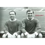 Autographed PAT CRERAND photo, a superb image depicting the Manchester United midfielder posing with