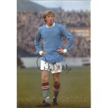 Colin Bell signed 12x8 colour photo pictured in action for Manchester City. Good Condition. All