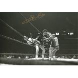 Autographed KEN BUCHANAN photo, a superb image depicting Buchanan going through the ropes after
